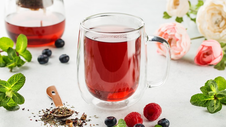 raspberries next to tea