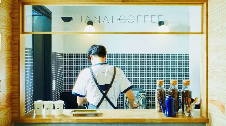 Employee working at Janai Coffee