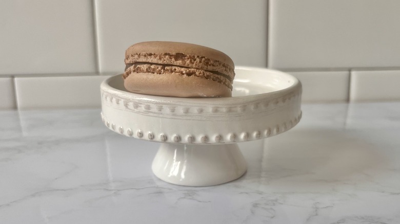 chocolate macaron on stand