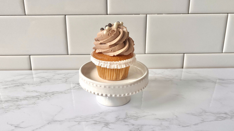 mini chocolate cupcake on stand