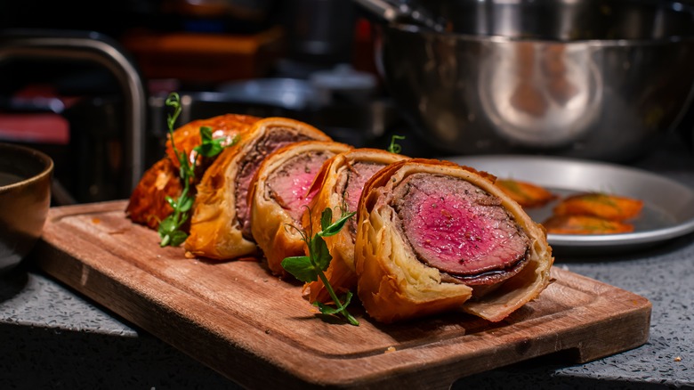 sliced beef Wellington on board