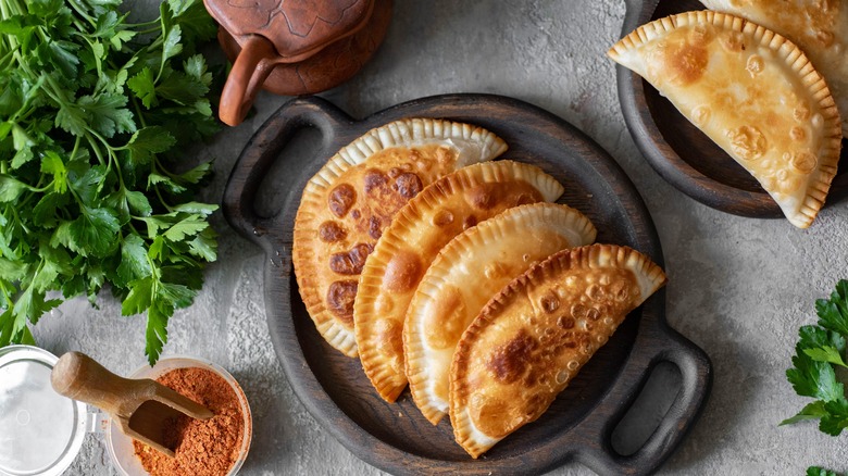 Fried turnovers in dish