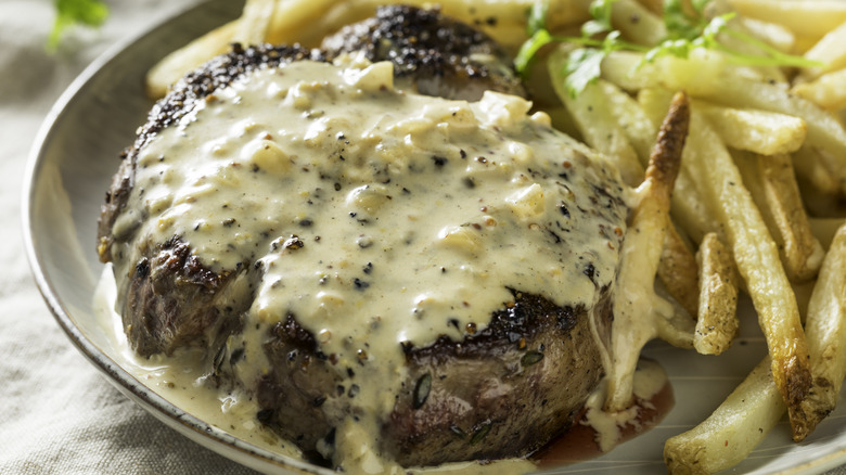 Steak with peppercorn sauce