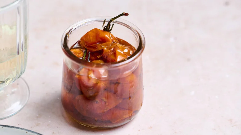 Small glass container with tomato confit
