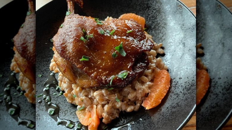 Fried duck quarter on pilaf