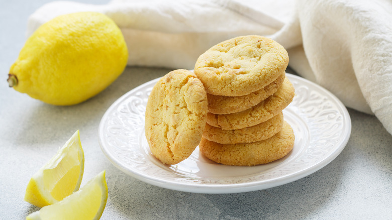 Lemon cookies stacked on plate