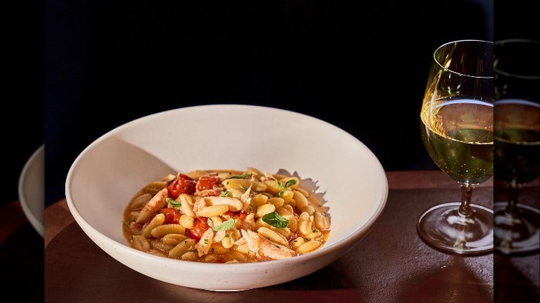 cavatelli in bowl with wine