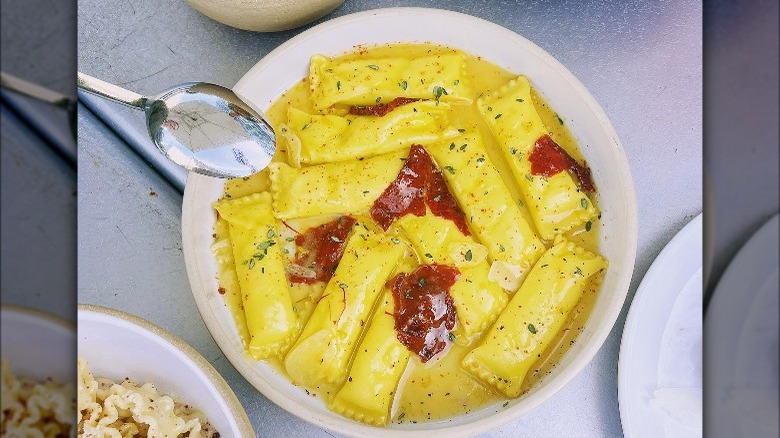 agnolotti with tomatoes in broth