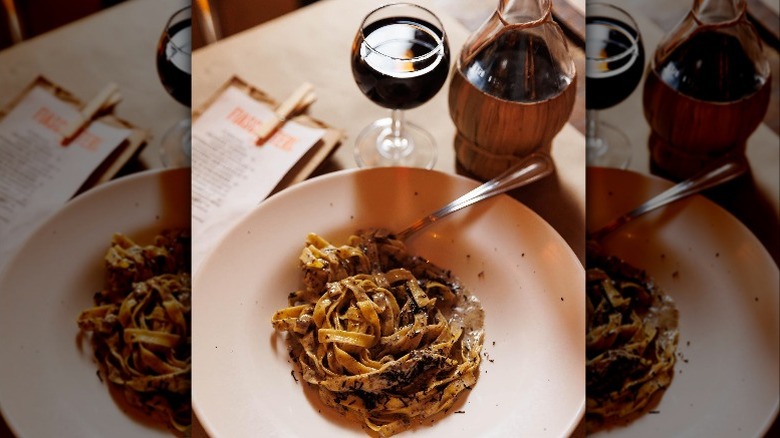 table with pasta and wine