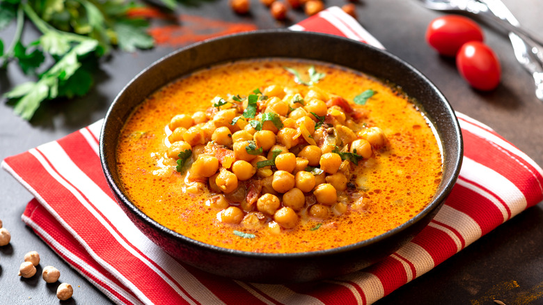 chickpea stew in dark bowl