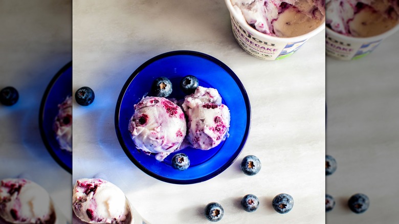 blue glass bowl of blueberry ice cream