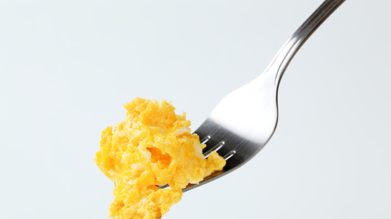 Scrambled eggs on fork