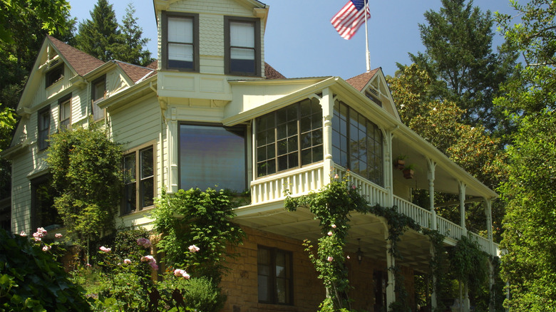 Yellow house with American flag