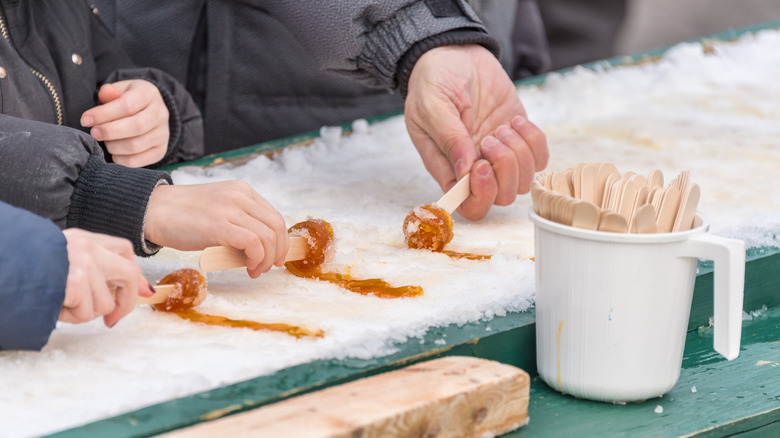 rolling maple taffy on snow