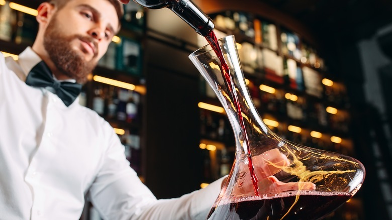 sommelier decanting wine