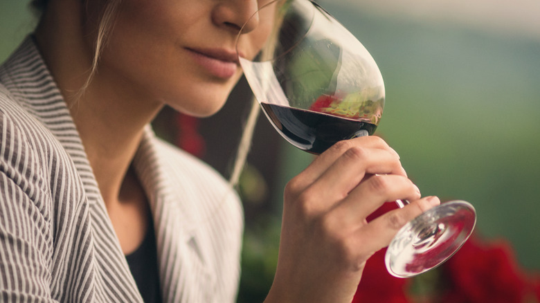 woman sniffing wine