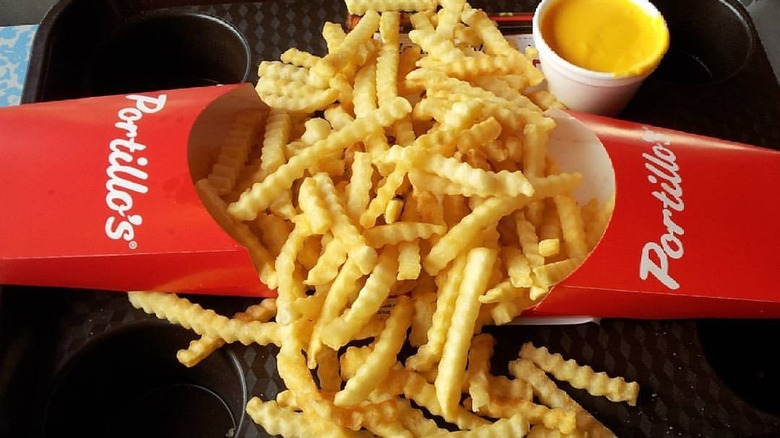 Fries spilling out of containers