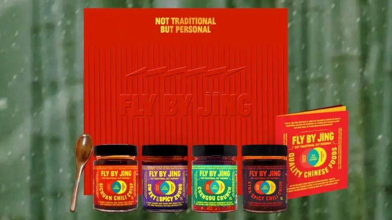 Jars of Fly by Jing condiments with red gift box