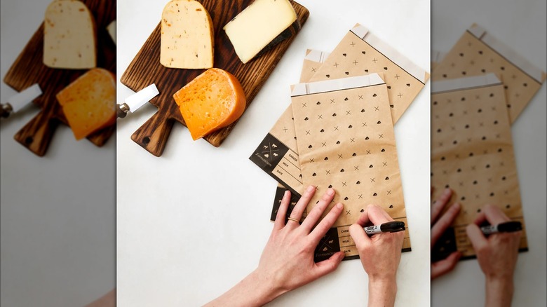 Formaticum Cheese Storage Bags next to cheese on cutting board