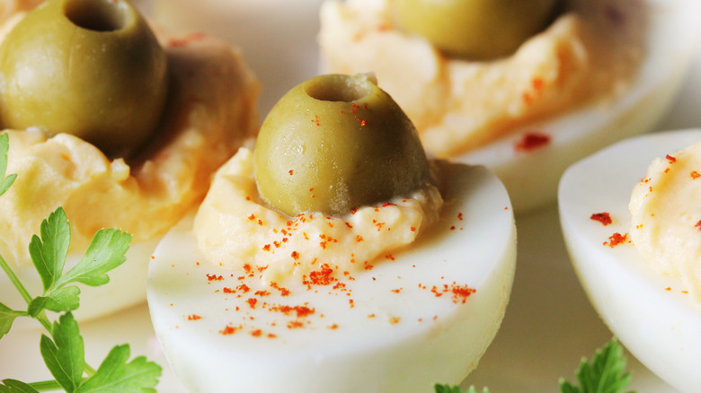 Deviled eggs with green olives