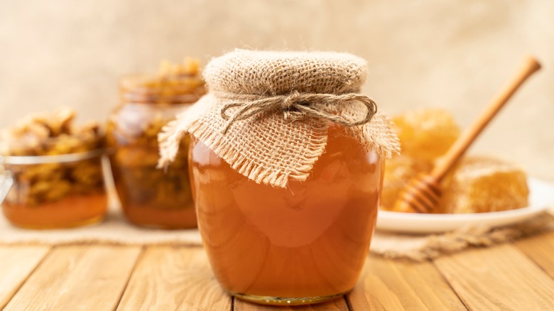 Honeycomb and jar of honey