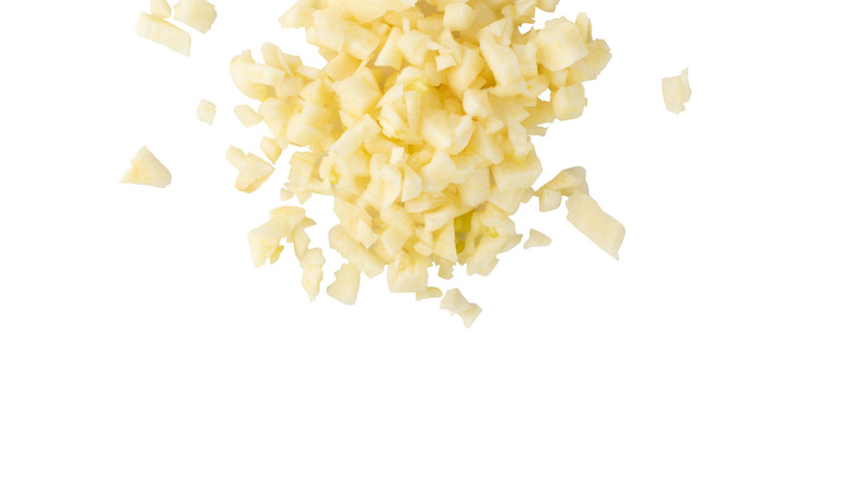 Minced garlic on white background