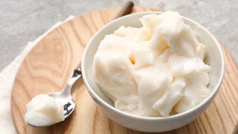 Lard in white bowl with spoon 