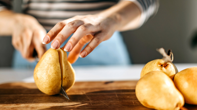 Person chopping pears