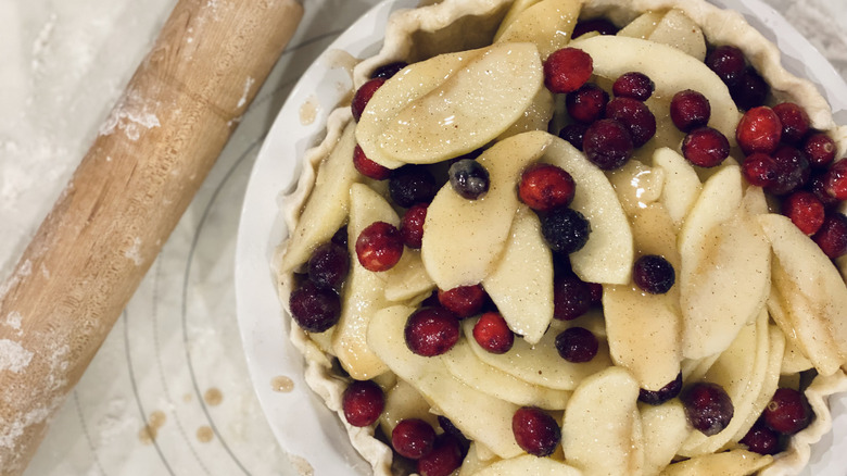 Apple cranberry pie on table