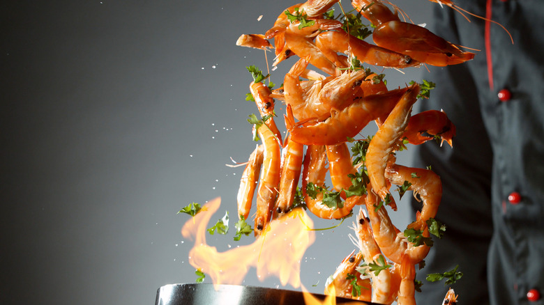 Shrimp being tossed in pan