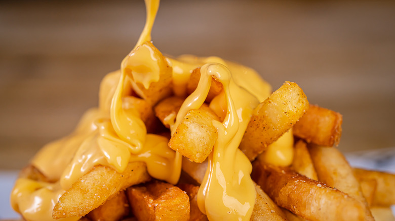 Cheese poured on fries