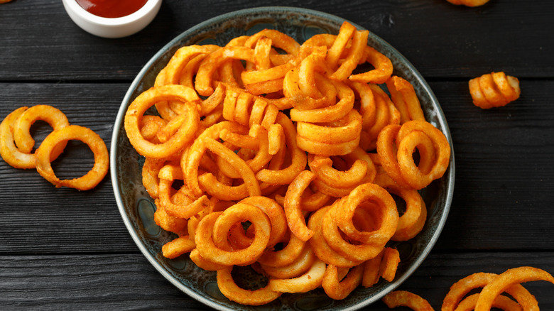 Seasoned curly fries in bowl