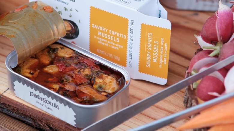 Tinned mussels on table