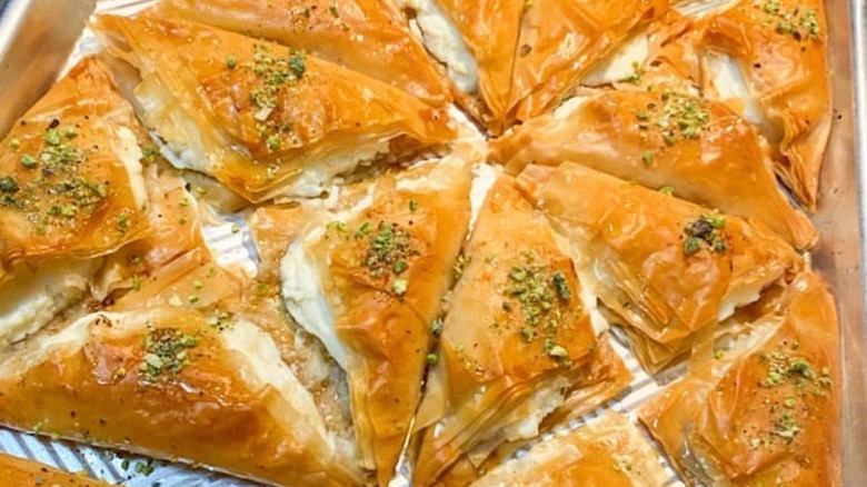 Cheese stuffed baklawa on tray