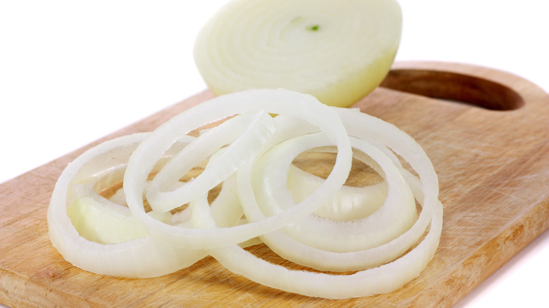 Onion slices on cutting board