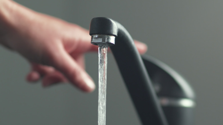 Hand and water faucet