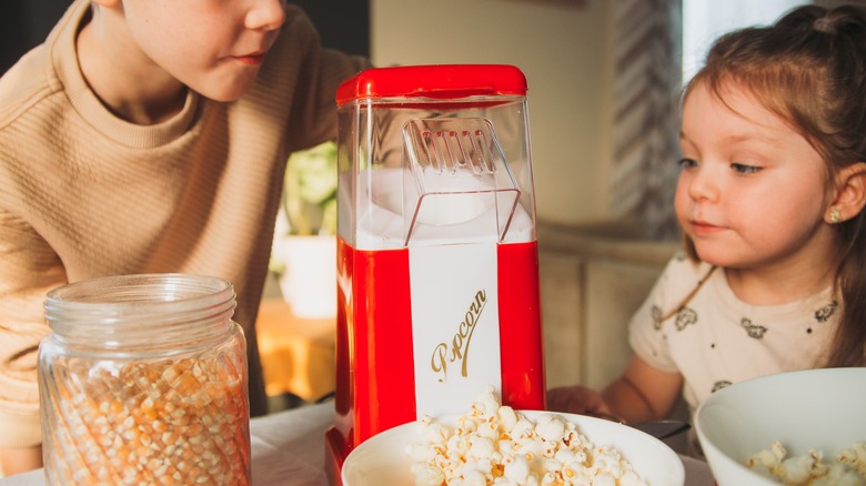 Kids and popcorn maker