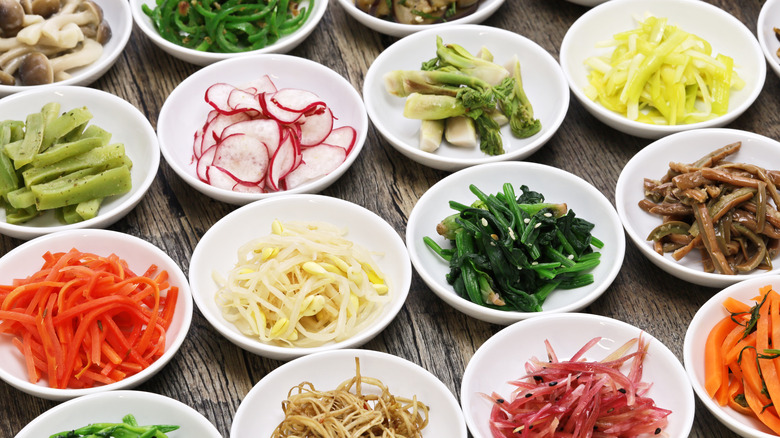 Several banchan plates on table 