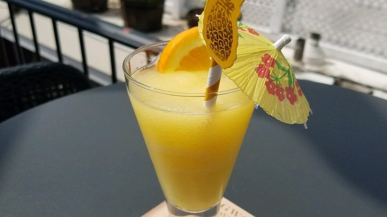 frozen peach Bellini with umbrella