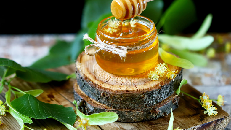 Honey jar with linden flowers