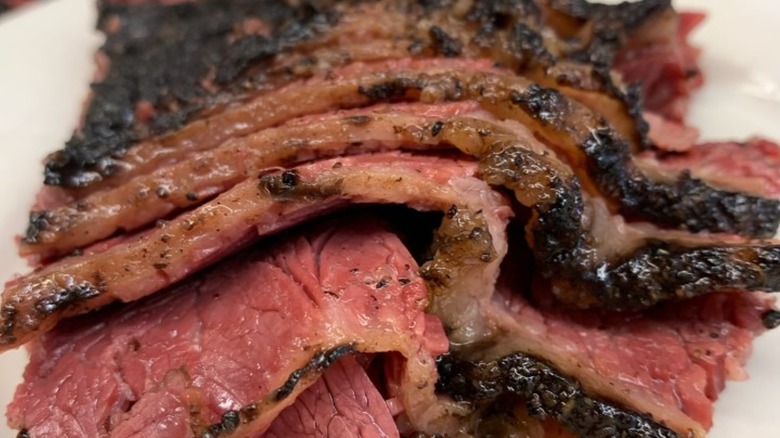 Sliced roast beef on white platter