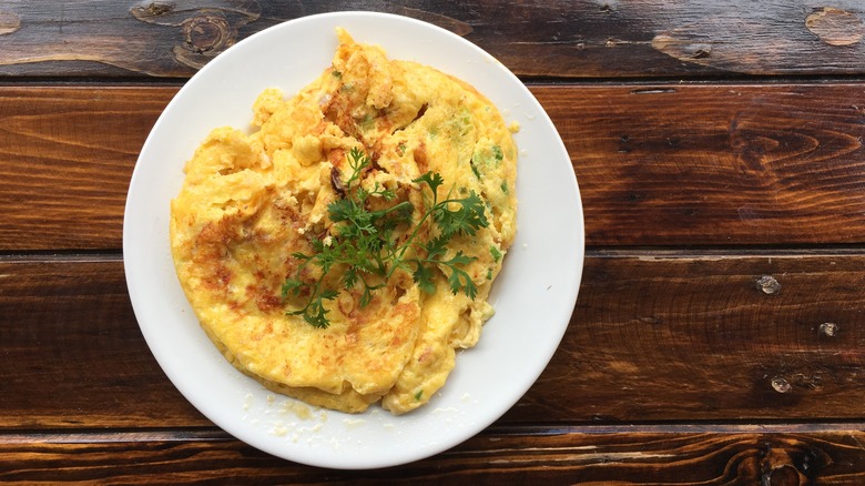 Thai omelette on white plate