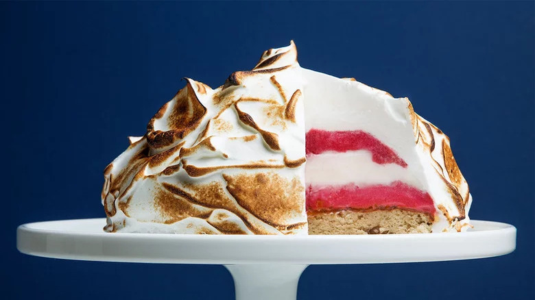 baked Alaska cake with slice