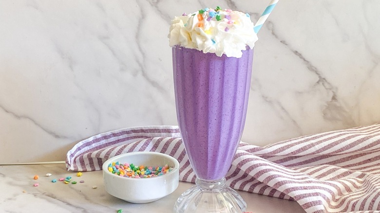 purple milkshake with sprinkles