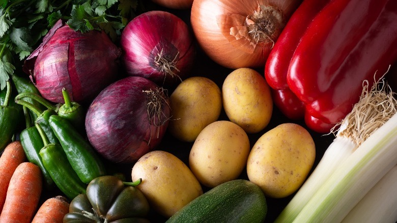 raw potatoes, onions, peppers, carrots