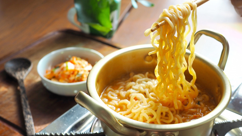 Instant noodles cooking in a pot