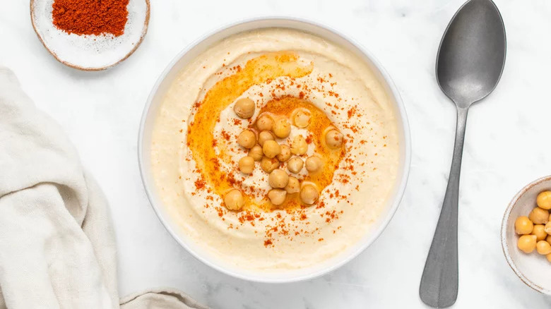 Hummus in bowl with chickpeas