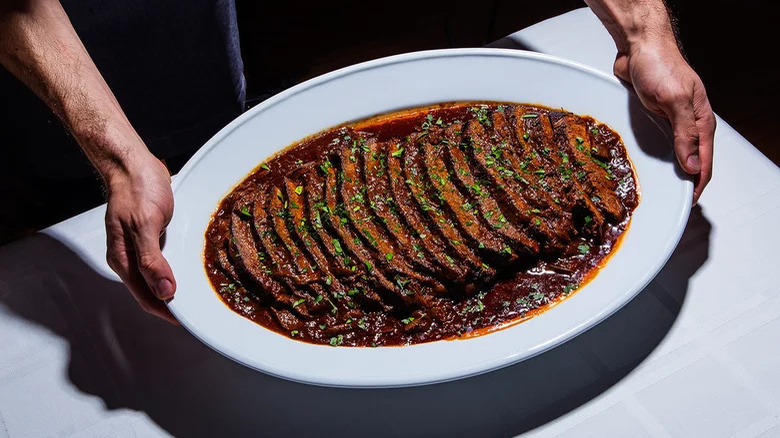 slices braised brisket in sauce