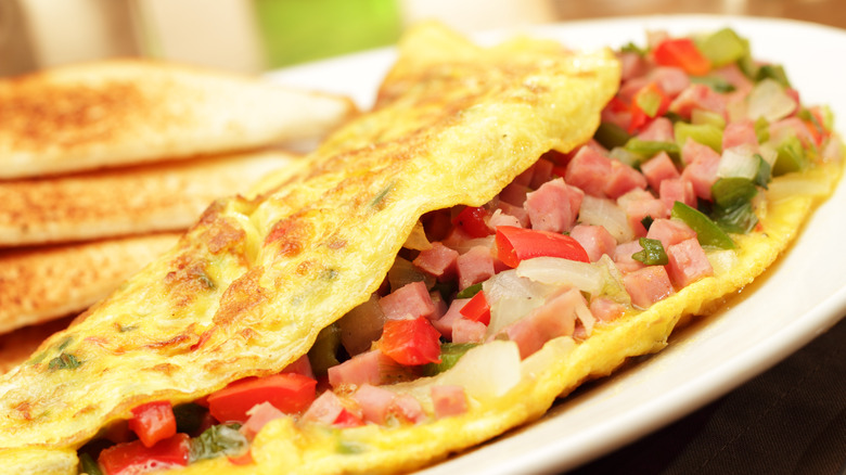 Omelette with veggies on plate