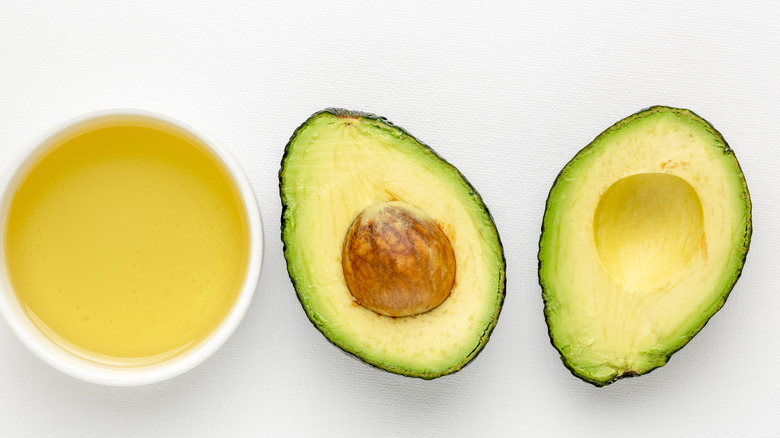 Avocados halves with oil
